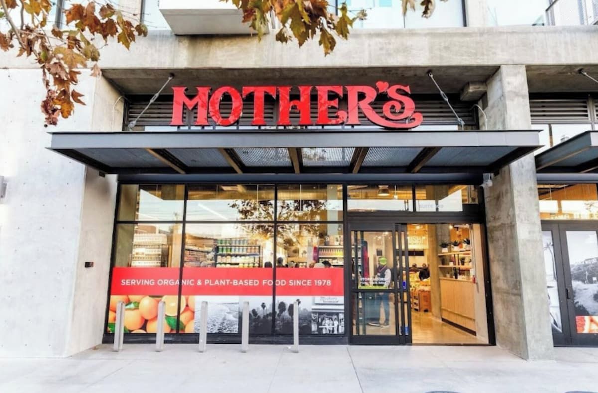 A storefront with a large sign reading 'MOTHER'S' and a banner stating 'SERVING ORGANIC & PLANT-BASED FOOD SINCE 1978'.