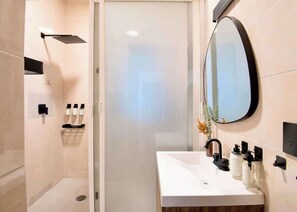 Shower, hair dryer, towels, soap