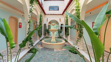 Deluxe Quadruple Room, Ensuite, Courtyard View | Courtyard view