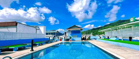 Outdoor pool, pool umbrellas, pool loungers