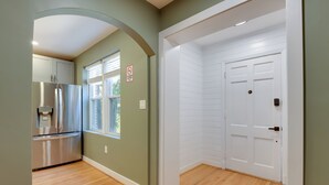 A kitchen with a stainless steel refrigerator, a water dispenser, and a window with blinds. - 8 Mi to DC: Cheverly Apt w/ Easy Metro Access (Cheverly)