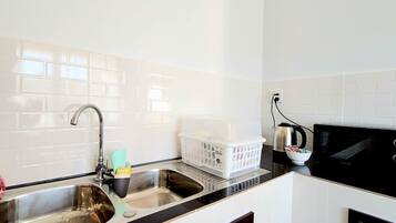 Fridge, microwave, cookware/dishes/utensils