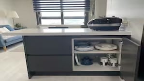 A compact kitchen with a built-in refrigerator, a sink, and a countertop. - River & Hill view Room (Ansan-si)