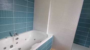 Shower, jetted bath, towels, soap
