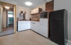 Fridge, stovetop, dishwasher, coffee/tea maker