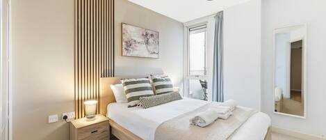 1 bedroom, desk, iron/ironing board, travel crib