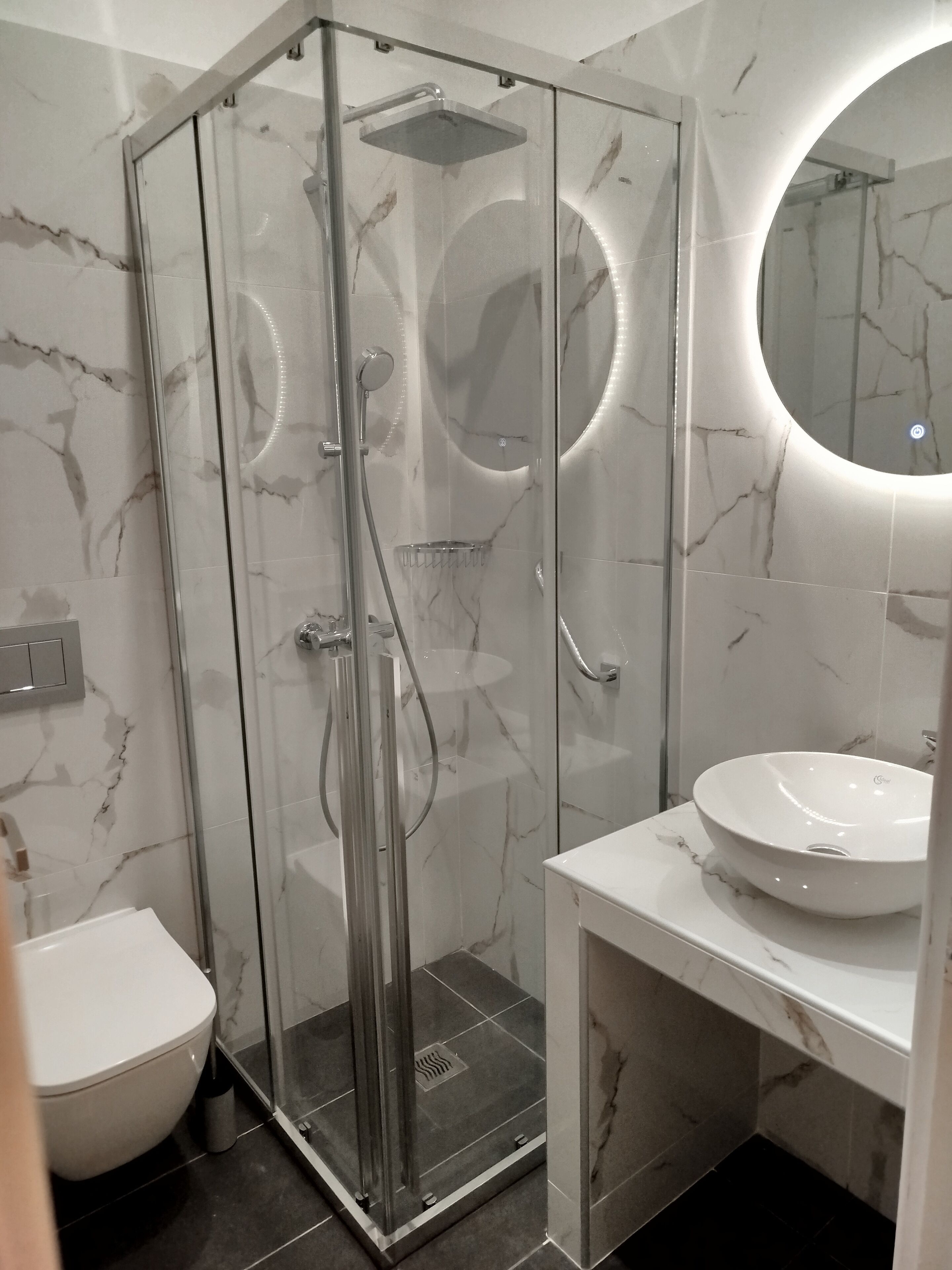 Shower, rainfall showerhead, hair dryer, towels