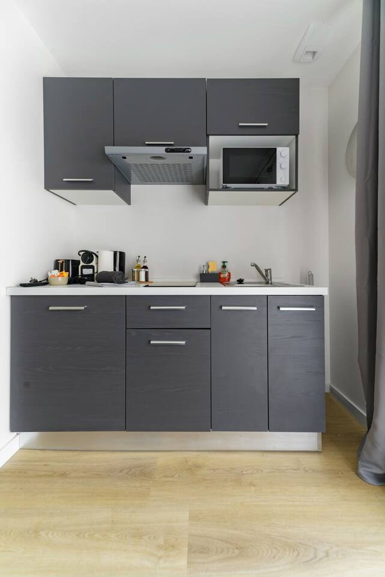 Fridge, microwave, stovetop, coffee/tea maker