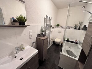 Hair dryer, towels, soap, toilet paper