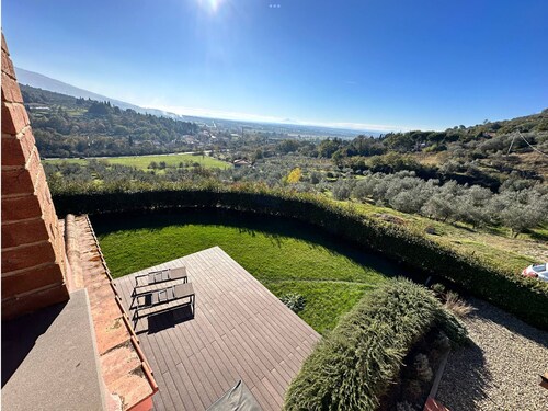 An oasis of peace and warmth of home, amidst thoughtful design and views toward the hills.