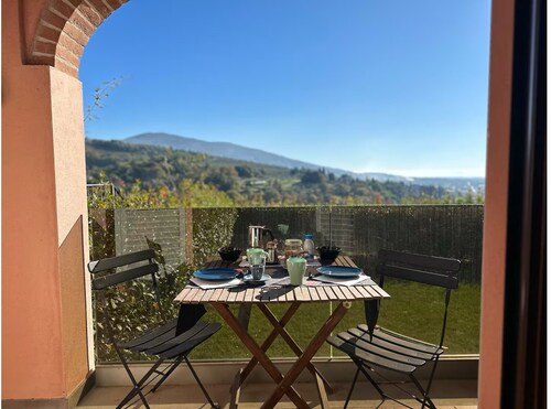 An oasis of peace and warmth of home, amidst thoughtful design and views toward the hills.