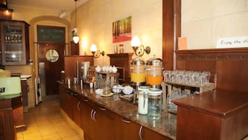 A bar area with a wooden counter, a clock, and a menu board.