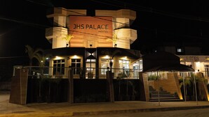 A hotel named JHS Palace with a modern design, featuring a prominent sign, a covered entrance, and a staircase leading to the main building. -  JHS Palace Hotel  (Boa Esperança)
