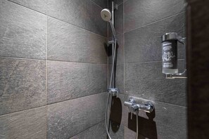 Shower, hair dryer, towels, toilet paper