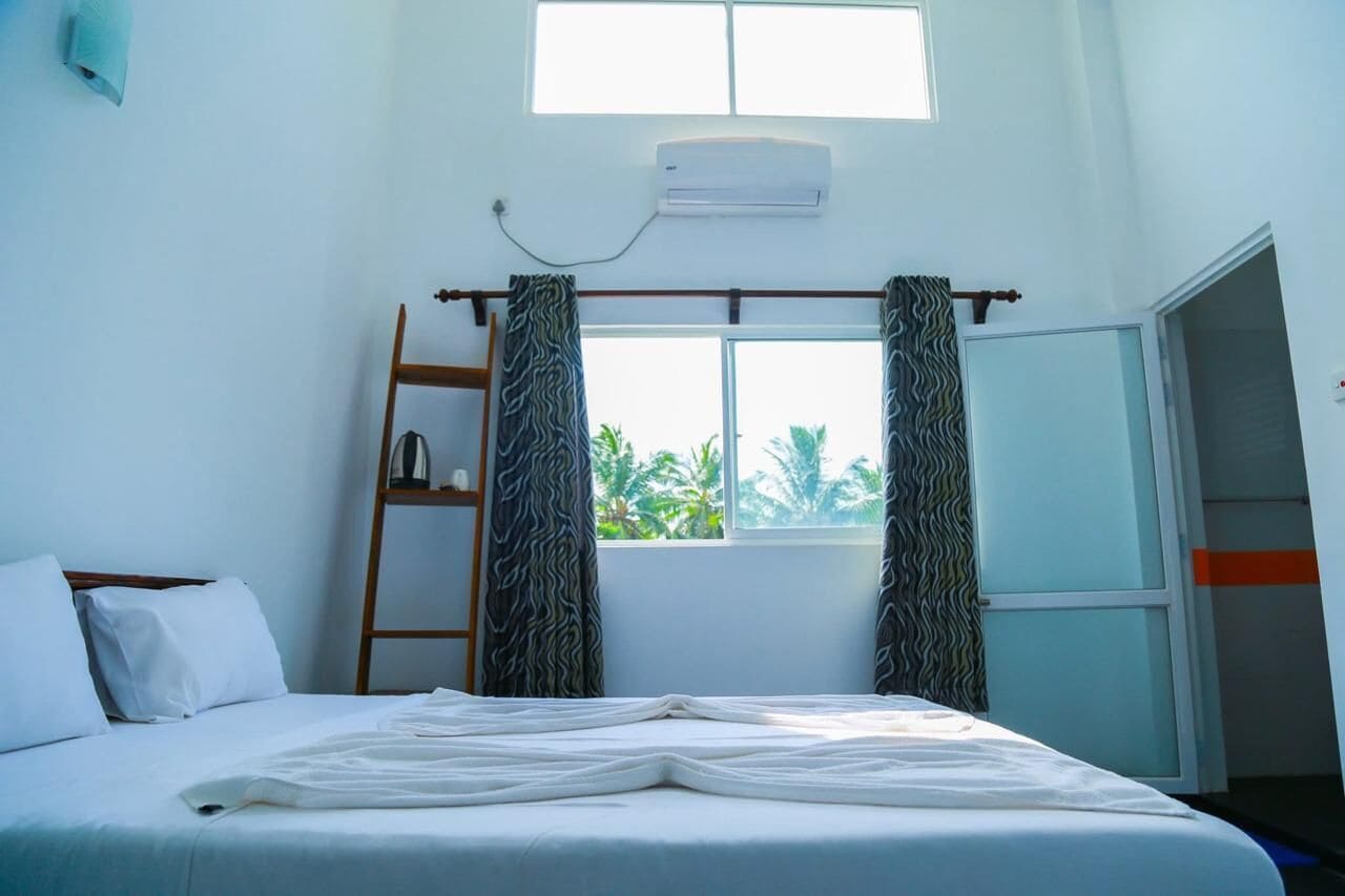 Deluxe Suite, Partial Ocean View | Desk, iron/ironing board, free WiFi