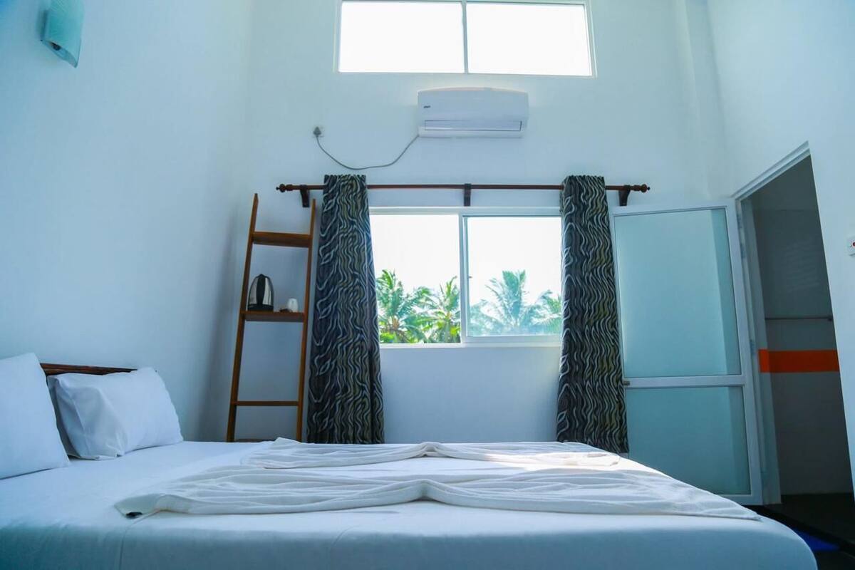 Deluxe Suite, Balcony, Partial Ocean View | Desk, iron/ironing board, free WiFi