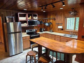 Microwave, oven, stovetop, dishwasher - River Camp Retreat, Sublime 3-bedroom River Front Cottage in Traverse City (Traverse City)