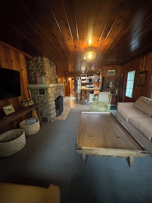 TV, fireplace - River Camp Retreat, Sublime 3-bedroom River Front Cottage in Traverse City (Traverse City)