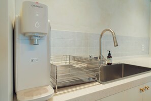 Fridge, microwave, high chair, cookware/dishes/utensils