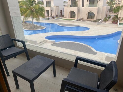 Swimming pool view apartment in Salalah