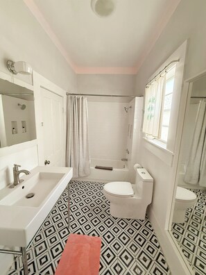 Shower, hair dryer, towels, soap