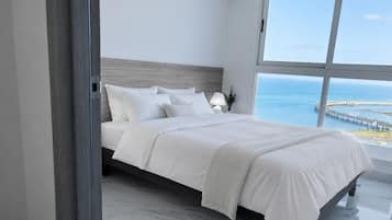 Executive Apartment, Ocean View | Minibar, individually decorated, individually furnished, desk
