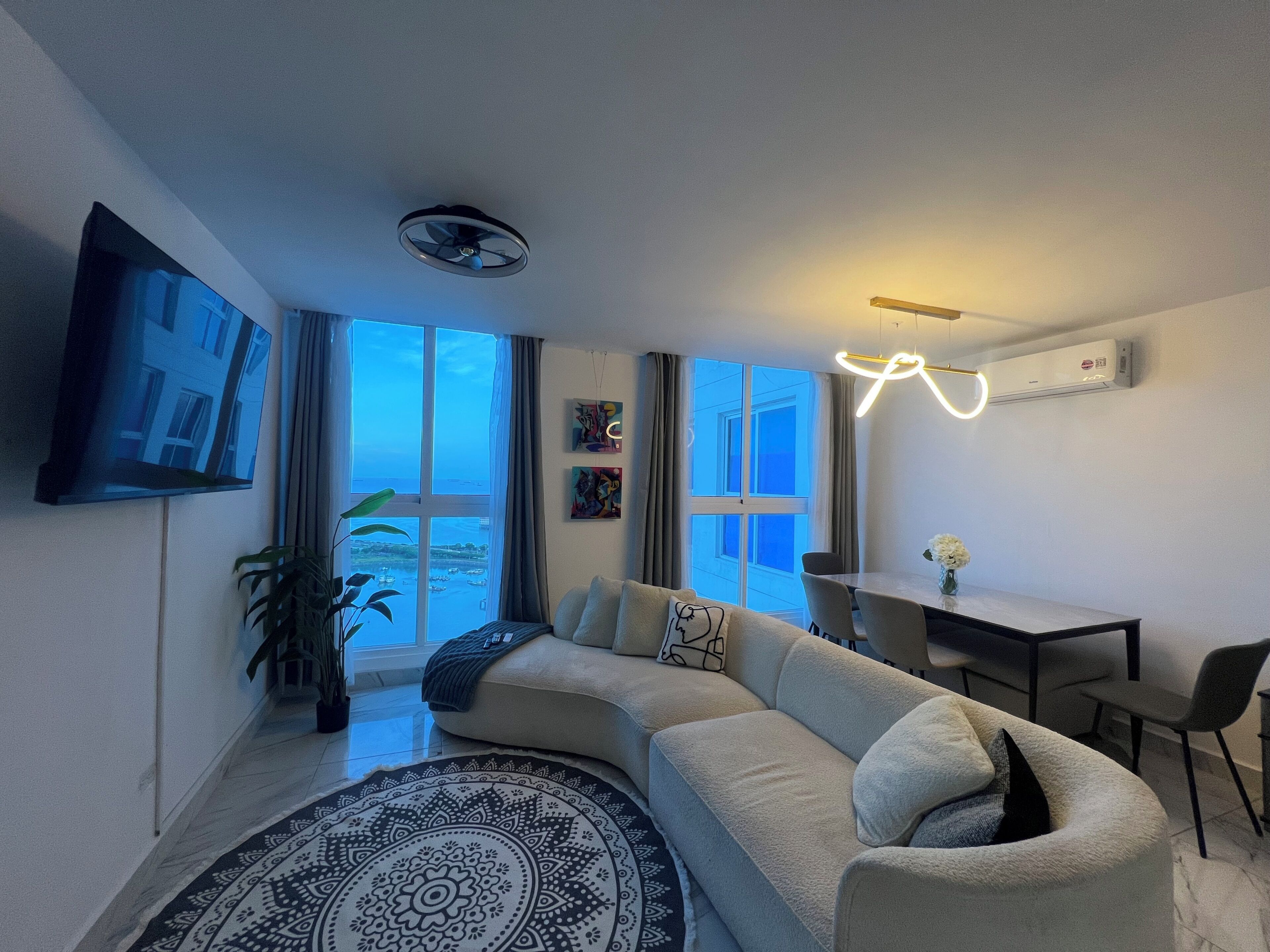 Comfort Apartment | Living area | 55-inch Smart TV with cable channels, toys