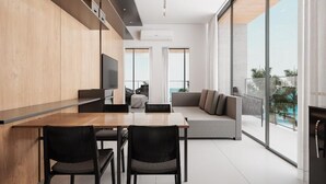 A modern living room with a large window, a sofa, and a dining area with chairs. - PORTO 2 LIFE RESORT - MARÉ ALTA (Ipojuca)