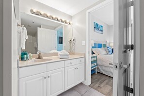 Shower, hair dryer, towels, toilet paper