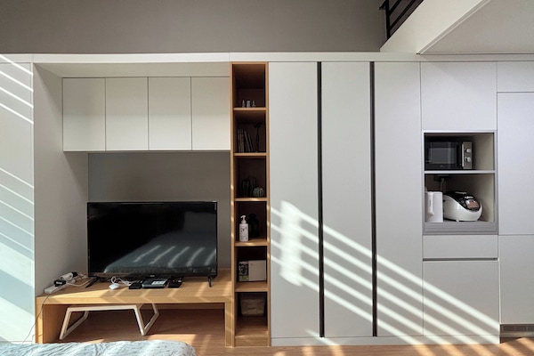 Built-in storage, TV and kitchen appliances