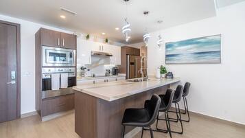 Condo, Multiple Beds, Balcony, Ocean View (Encantame Towers Velero 1802) | Private kitchen | Dining tables