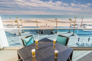 A balcony with a view of a beach and pool area. - Splash in The New Lazy River and Sleep In Luxury Encantame Towers Velero 303 (Puerto Peñasco)