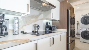 Condo, Multiple Beds, Balcony, Ocean View (Encantame Towers Viento 2104) | Private kitchen | Dining tables