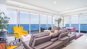 Condo, Multiple Beds, Balcony, Ocean View (Encantame Towers Verano 2005) | Living area | 42-inch flat-screen TV with digital channels