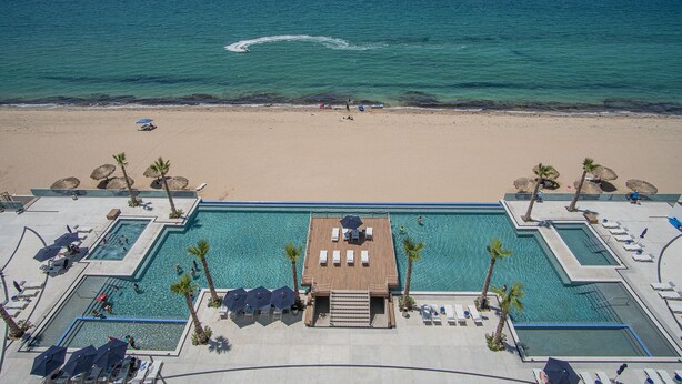 A resort with a large pool area, a beach, and a view of the ocean. - Stay in Luxury/splash in New Lazy River This Winter Encanatame Towers 903 (Puerto Peñasco)