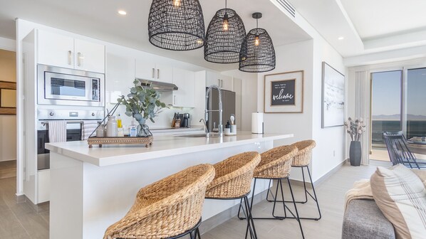 Condo, Multiple Beds, Balcony, Ocean View (Encantame Towers Verano 2103) | Private kitchen | Dining tables