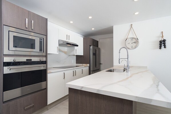 Condo, Multiple Beds, Balcony, Ocean View (Encantame Towers Velero 702) | Private kitchen | Dining tables - Splash in New Lazy River/stay in Modern Luxury Encantame 702 (Puerto Peñasco)