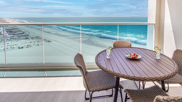 A balcony with a view of the beach and ocean. - Panoramic Beach Front Condo Verano 1703 (Puerto Peñasco)