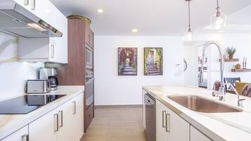 Condo, Multiple Beds, Balcony, Ocean View (Encantame Towers Verano 1402) | Private kitchen | Dining tables