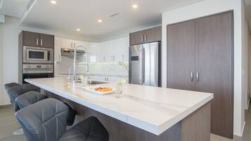 Condo, Multiple Beds, Balcony, Ocean View (Encantame Towers Velero 1701) | Private kitchen | Dining tables