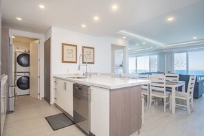 Condo, Multiple Beds, Balcony, Ocean View (Encantame Towers Velero 2202) | Private kitchen | Dining tables