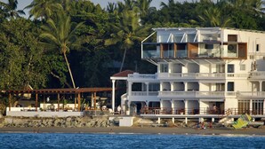 A multi-story beachfront hotel with balconies, a pool area, and a beach view. - Ultra Infinity Hotel (Cabarete)