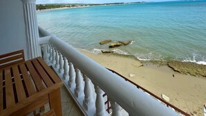 A balcony with a view of the beach and ocean. - Ultra Infinity Hotel (Cabarete)