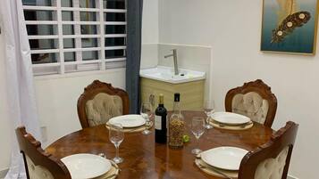 Attico Deluxe, balcone, vista giardino | Area soggiorno