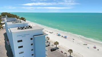 On the beach, sun loungers, beach towels