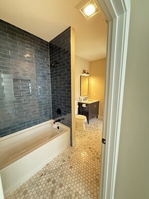 Shower, hair dryer, towels, soap