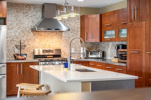 Fridge, microwave, oven, stovetop - Canal-Front 5BR Home with Pool Near Port Canaveral and Kennedy Space Center (Merritt Island)