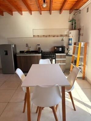 Full-sized fridge, microwave, oven, cookware/dishes/utensils