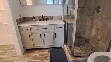 Shower, towels, soap, toilet paper