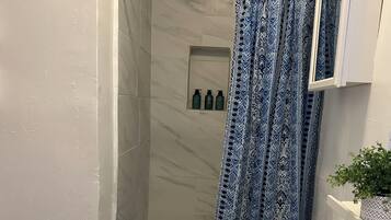 Shower, towels, soap, toilet paper